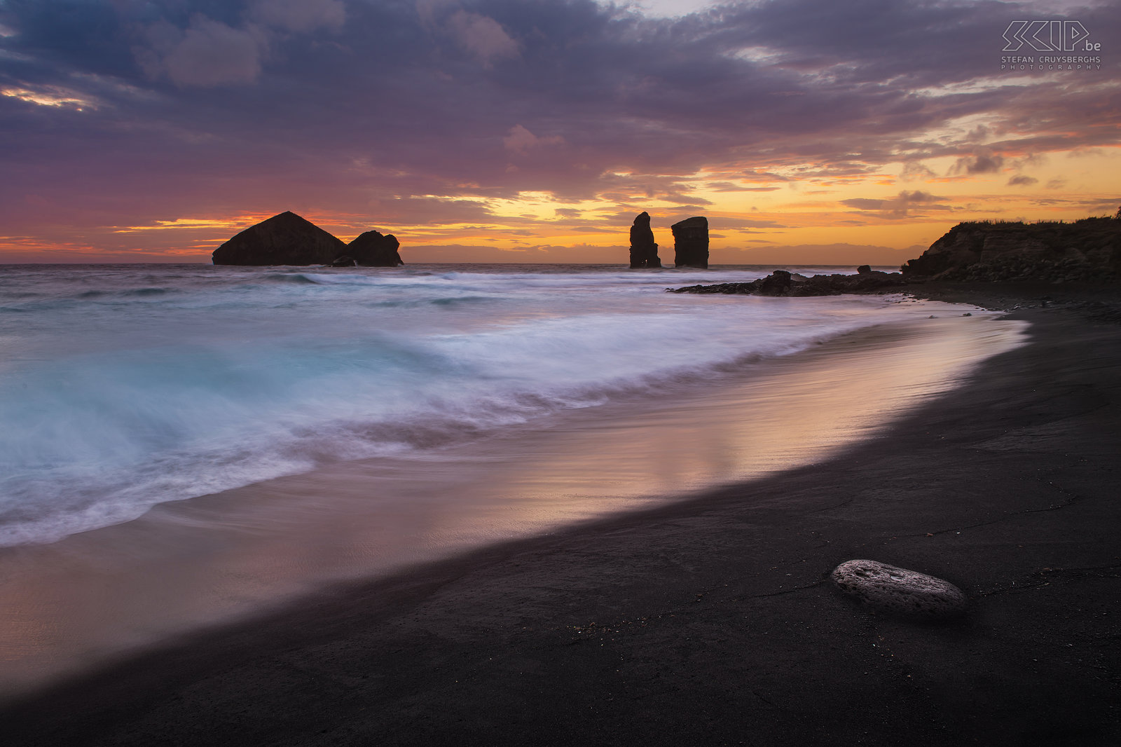 Sunset Mosteiros A beautiful and colorful sunset at the black sandy beach of Mosteiros at the west coast of the island of São Miguel. Stefan Cruysberghs